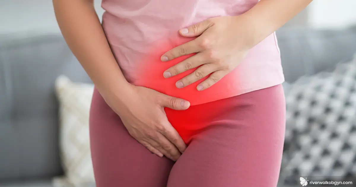 Woman hand over pelvic with endometriosis symptoms